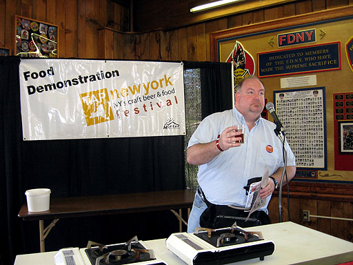 Steve shows the audience how to drink beer!